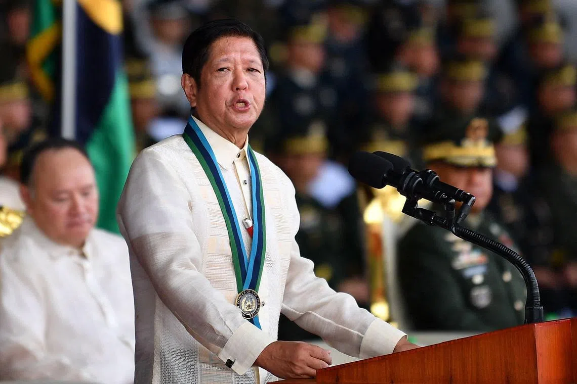 Philippines' President Ferdinand Marcos Jr. delivers a speech inside the military headquarters in Manila on December 20, 2024. 