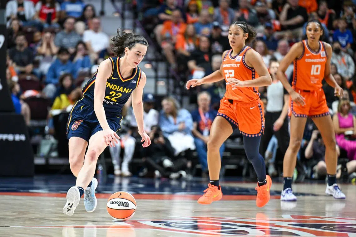 FILE PHOTO: Sep 22, 2024; Uncasville, Connecticut, USA; Indiana Fever guard Caitlin Clark (22) chases a loose ball in the fourth quarter during game one of the first round of the 2024 WNBA Playoffs at Mohegan Sun Arena. Mandatory Credit: Mark Smith-Imagn Images/File Photo