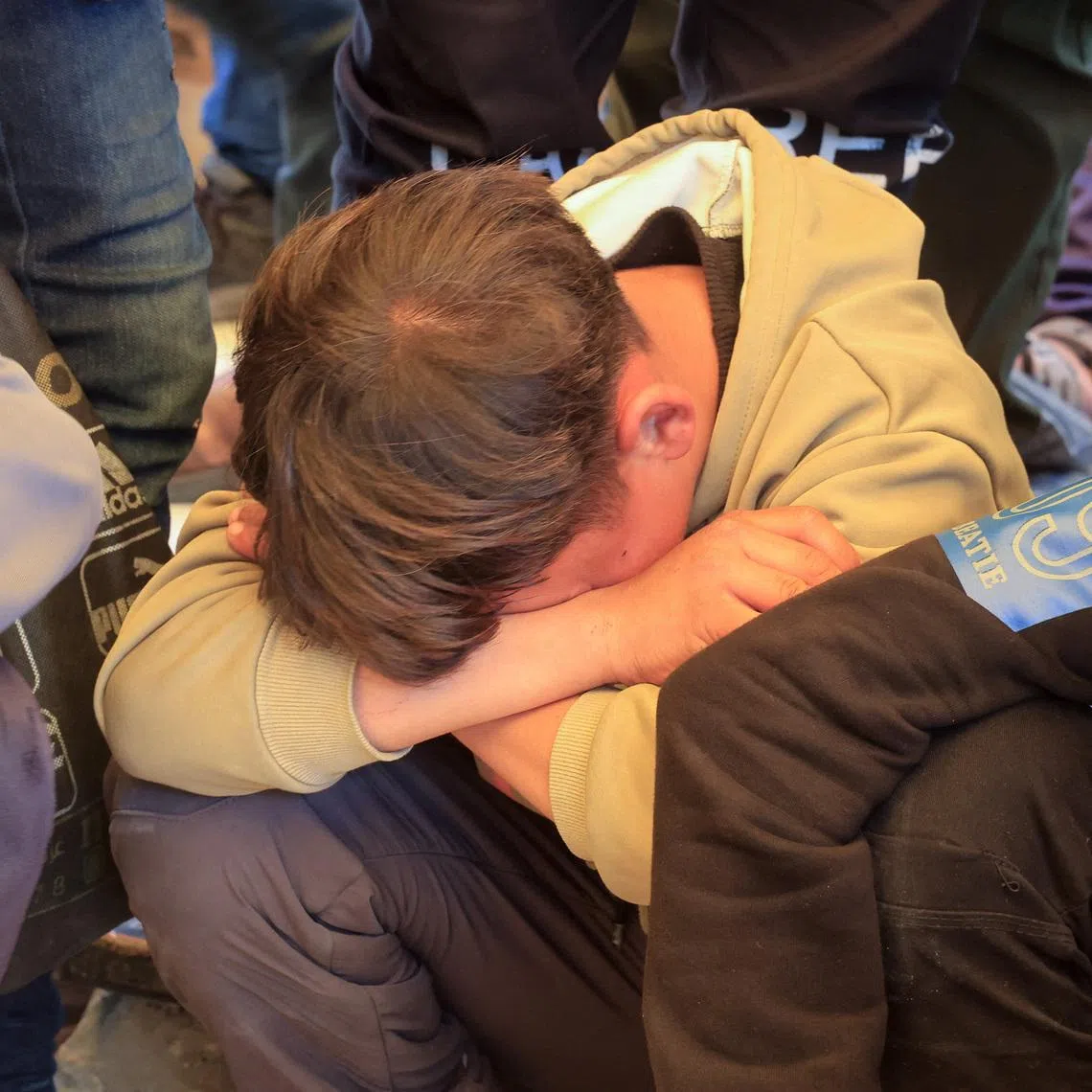 A mourner reacts during the funeral of Palestinian father Mahmoud Al-Bayouk and his two-year-old son Yahia, who were killed in an Israeli strike, according to medics, at Nasser Hospital in Khan Younis, in the southern Gaza Strip, March 31, 2026. REUTERS/Haseeb Alwazeer