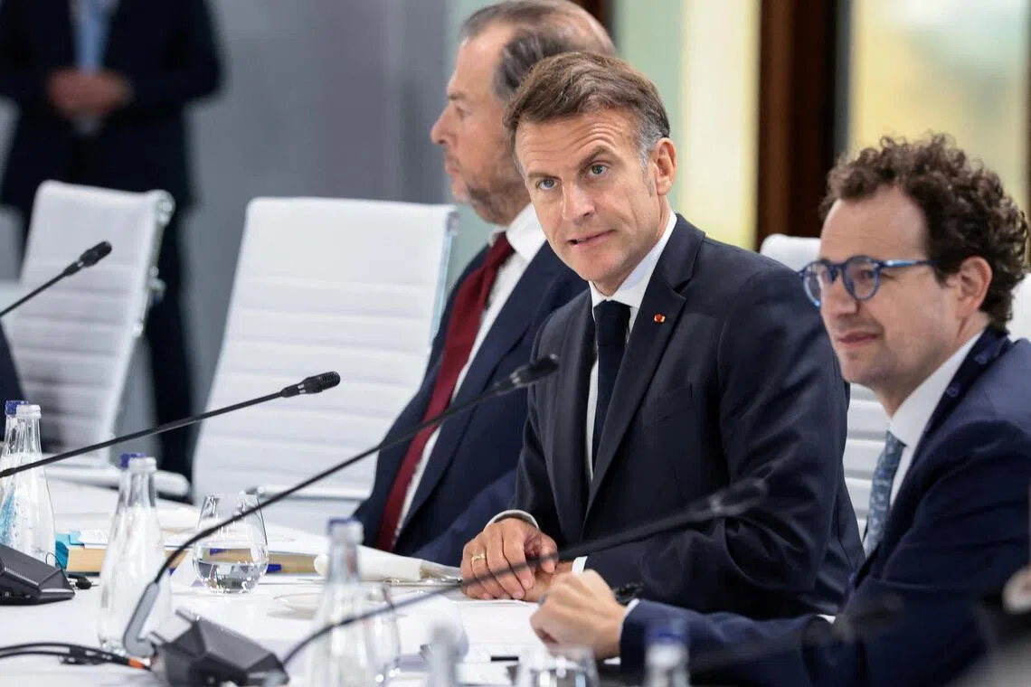 French President Emmanuel Macron and Anthropic CEO Dario Amodei attend a working lunch with G-7 leaders and global tech CEOs in Evian-les-Bains, France, on June 17.