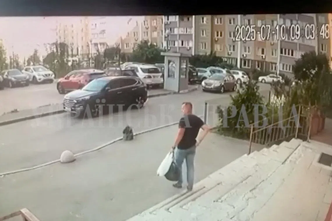 A CCTV footage shows a Security Service of Ukraine (SBU) officer walking down the stairs moments before he was shot in Kyiv, Ukraine July 10, 2025 in this screengrab obtained from a social media video. Ukrainska Pravda/via REUTERS  THIS IMAGE HAS BEEN SUPPLIED BY A THIRD PARTY. MANDATORY CREDIT. UKRAINE OUT. NO COMMERCIAL OR EDITORIAL SALES IN UKRAINE. RUSSIA OUT. NO COMMERCIAL OR EDITORIAL SALES IN RUSSIA. WATERMARK FROM SOURCE.  VERIFICATION: - Guard box, buildings and parking lot layout matched file and satellite imagery - Date verified by timestamp and Reuters reporting