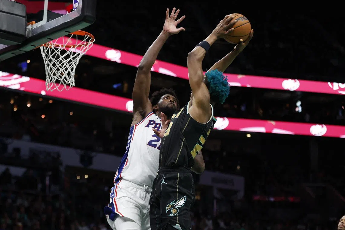 Philadelphia 76ers centre Joel Embiid tries to stop Charlotte Hornets forward Kai Jones from scoring during the second half at Spectrum Centre.