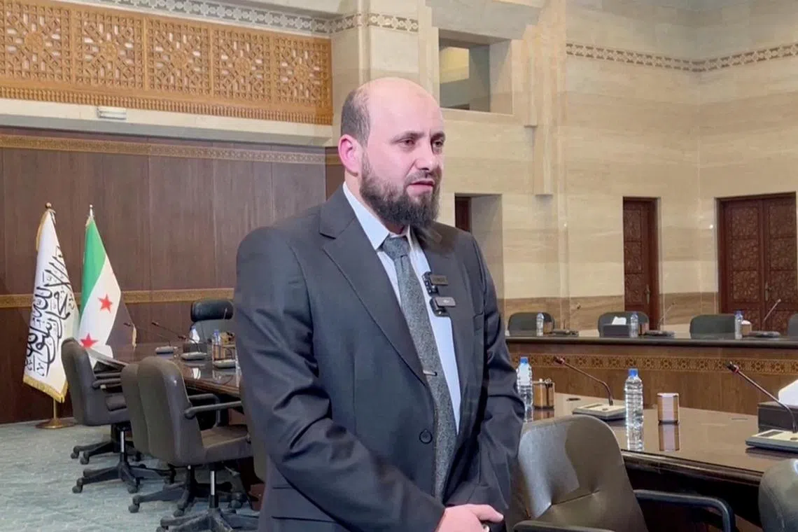 Caretaker Syrian PM Mohamed al-Bashir speaking in Damascus on Dec 10, in a screen grab from a handout video.