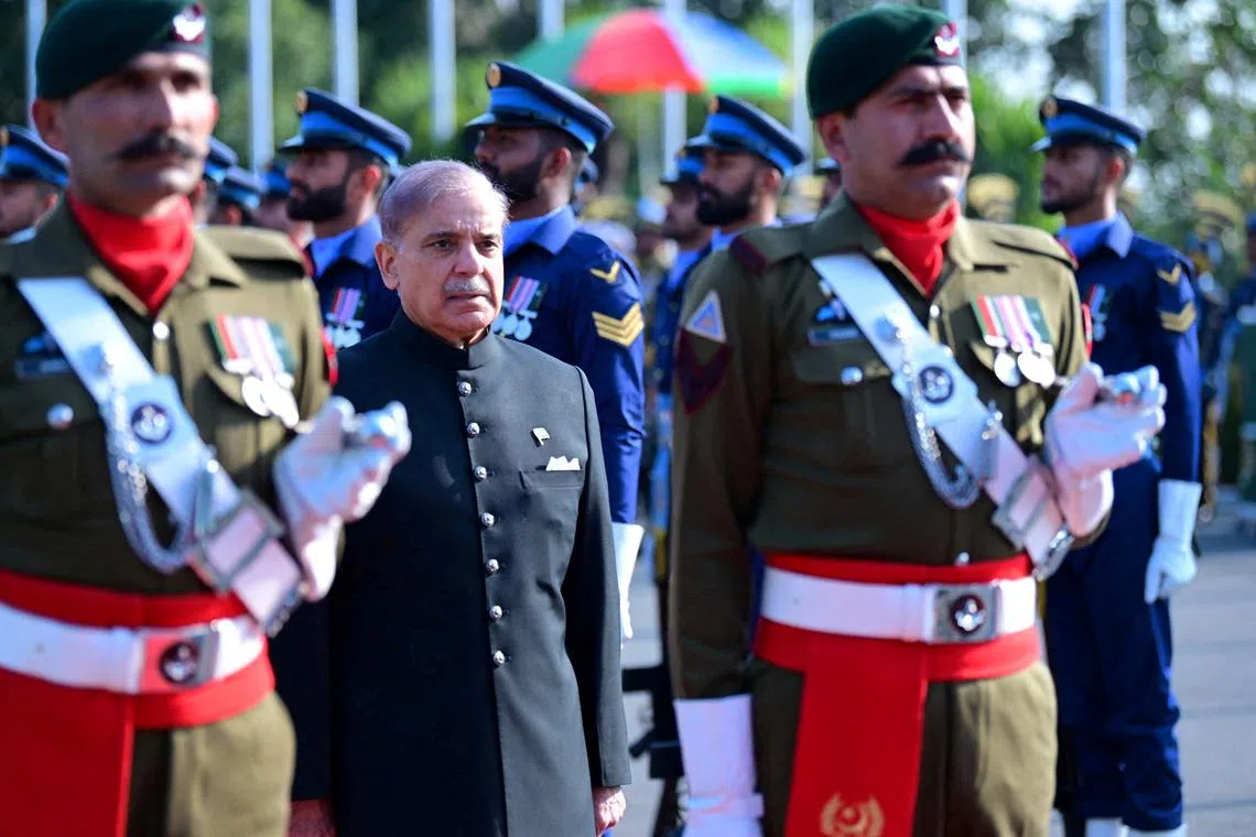 FILE PHOTO: Pakistan's newly elected Prime Minister Shehbaz Sharif, inspects the honor guard at the Prime Minister's House in Islamabad, Pakistan March 4, 2024. Prime Minister's House/Handout via REUTERS/File Photo