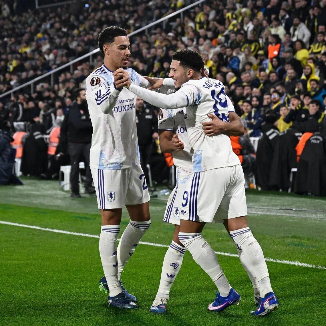 Aston Villa's Jadon Sancho celebrates with teammates after scoring the winning goal.