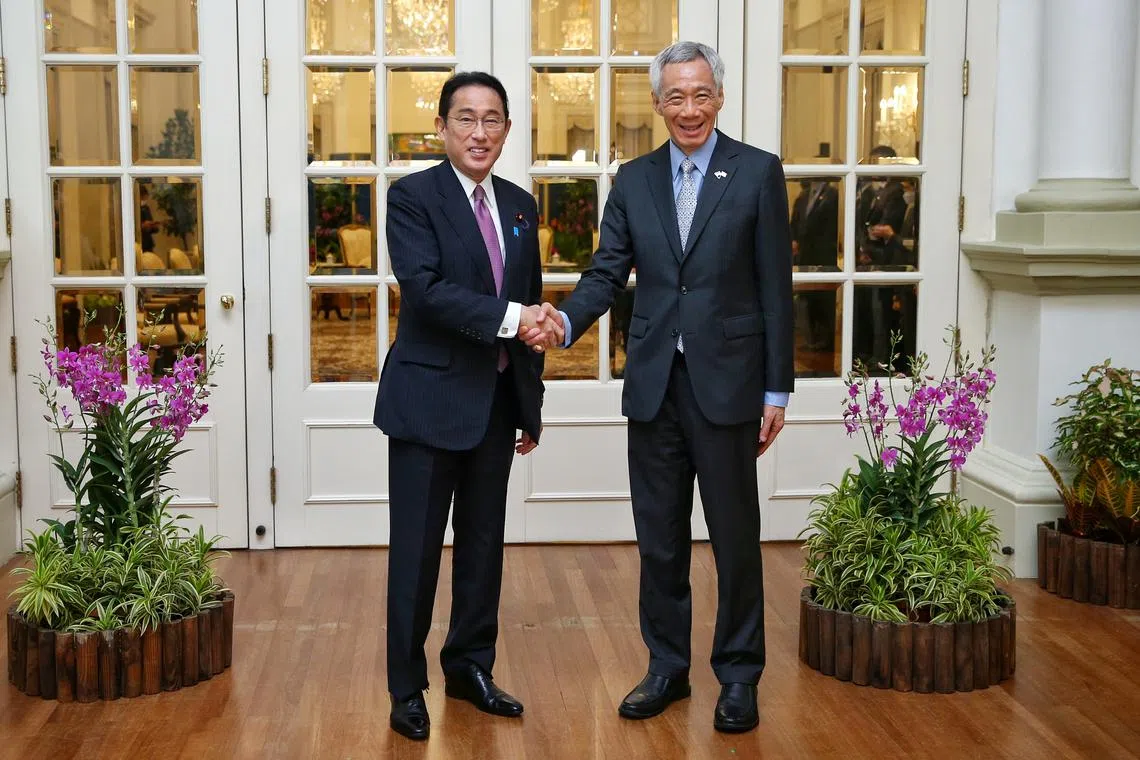 File photo of Mr Fumio Kishida (left) and PM Lee Hsien Loong during a state visit to the Istana in 2022.