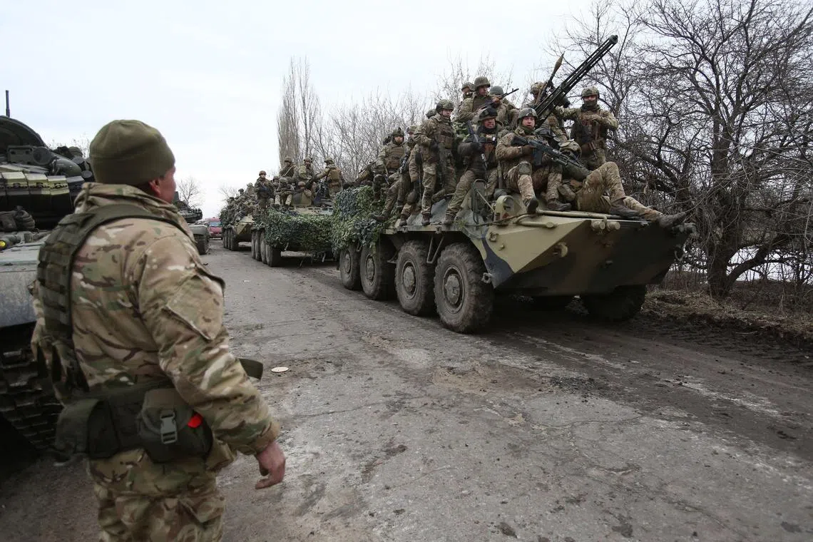 Ukrainian servicemen get ready to repel an attack in Ukraine's Lugansk region in Feb, 2022.