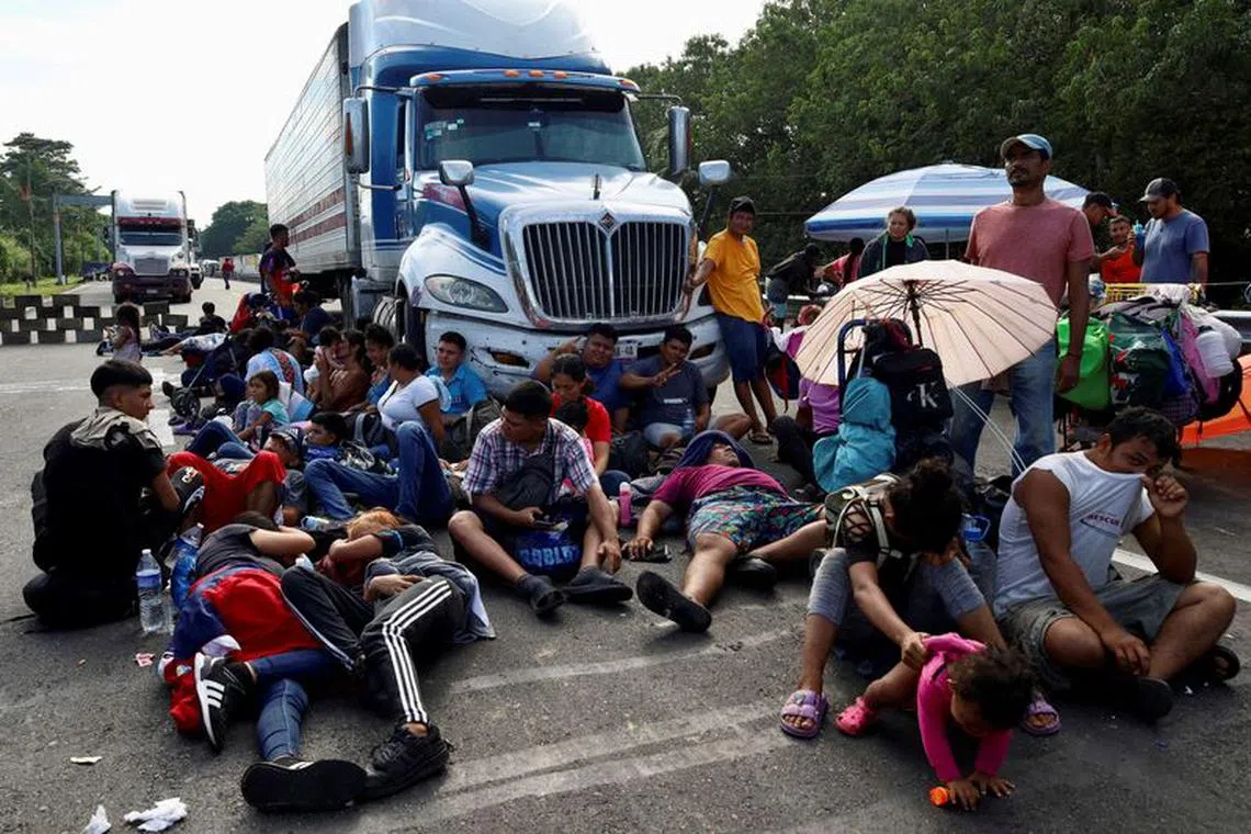 FILE PHOTO: Migrants hold a protest blocking a highway demanding authorities free transit through Mexico, as they attempt to reach the U.S. border, in Huixtla, Mexico November 8, 2023. REUTERS/Jose Torres/File Photo