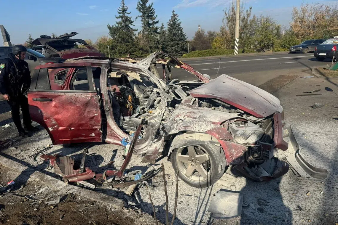A destroyed car hit by a Russian drone, where, according to local government, two journalists of the Ukrainian TV channel \"Freedom\", Olena Hubanova and Yevhen Karmazin, were killed, amid Russia's attack on Ukraine, in the city of Kramatorsk, Donetsk region, Ukraine, October 23, 2025. Head of Donetsk Regional Military Administration Vadym Filashkin via Telegram/Handout via REUTERS