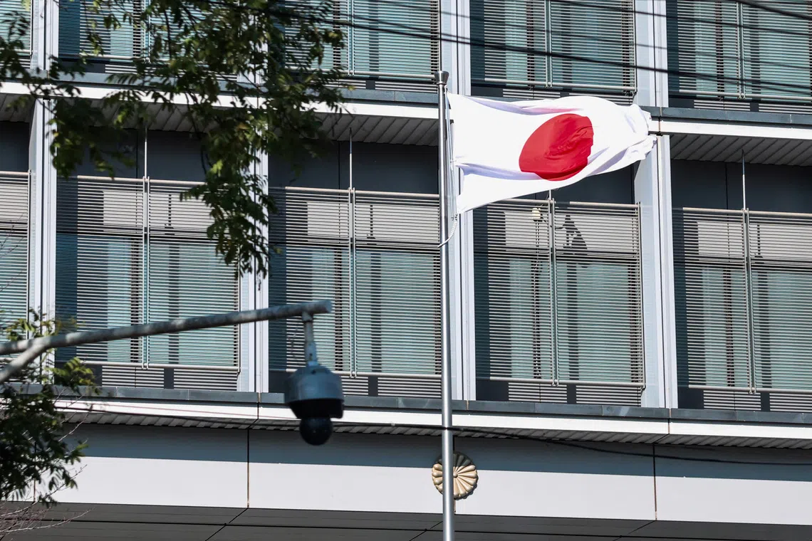 Japan’s national flag flutters next to a surveillance camera at the Embassy of Japan in Beijing, China, November 18, 2025. REUTERS/Maxim Shemetov