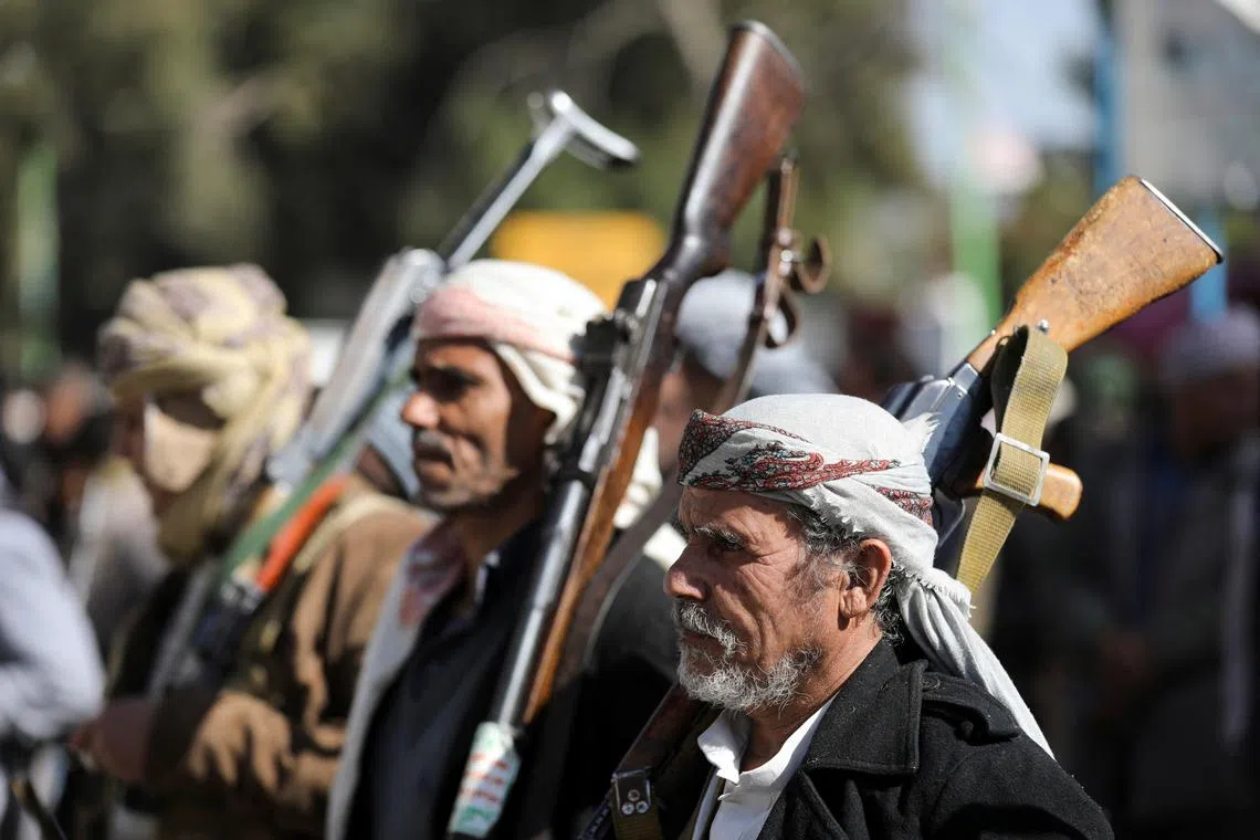 People participate in a parade after attending a Houthi military training as part of a mobilization campaign, in Sanaa, Yemen December 18, 2024. REUTERS/Khaled Abdullah/File photo