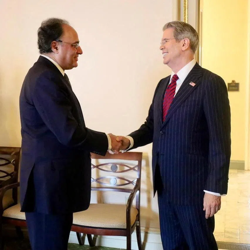 Pakistani Finance Minister Muhammad Aurangzeb and U.S. Treasury Secretary Scott Bessent shake hands as they meet in Washington, D.C., U.S., July 21, 2026. Ministry of Finance/Handout via REUTERS