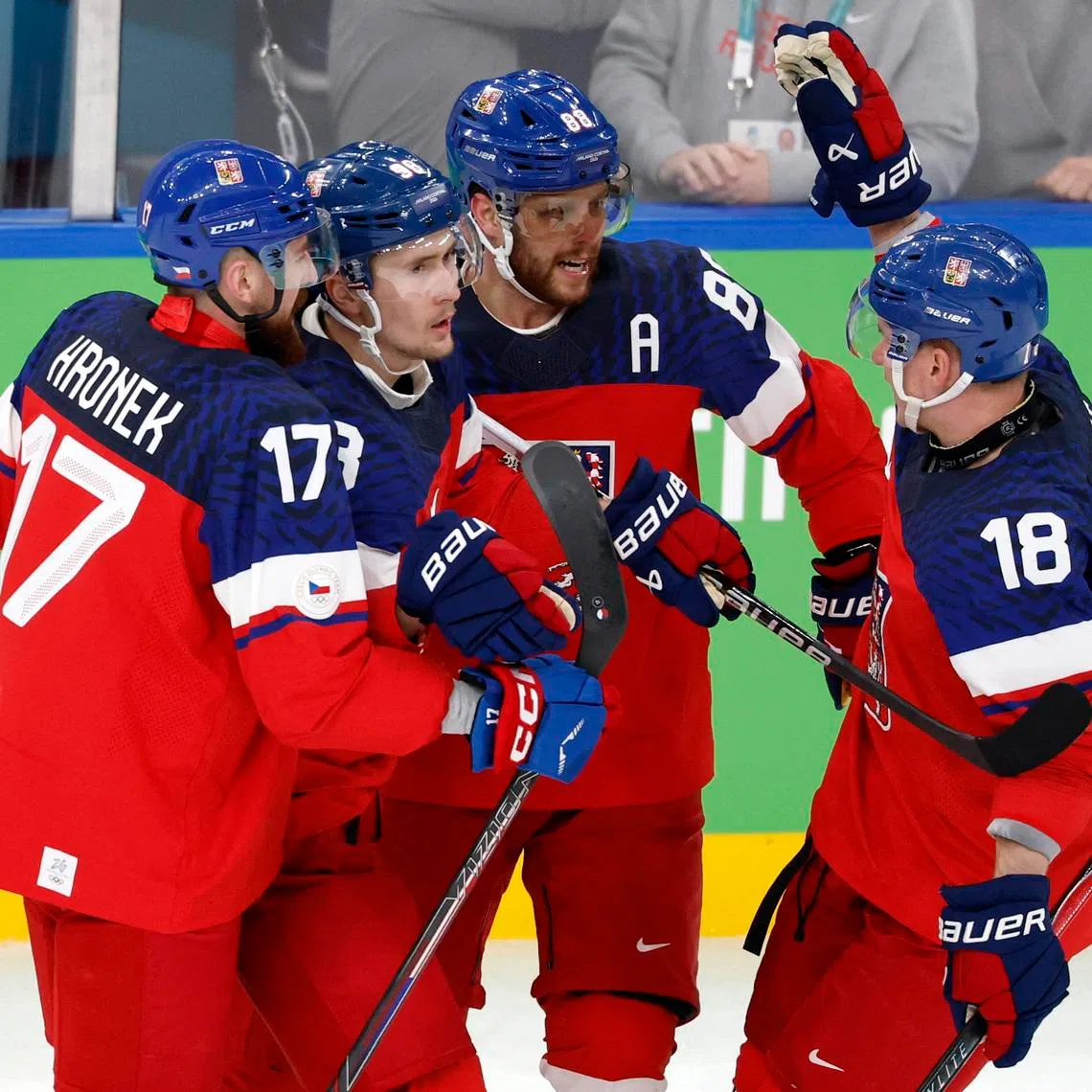 Milano Cortina 2026 Olympics - Ice Hockey - Men's Qualification Play-off - Czech Republic vs Denmark - Milano Santagiulia Ice Hockey Arena, Milan, Italy - February 17, 2026. Martin Necas of Czech Republic celebrates with Ondrej Palat of Czech Republic and Filip Hronek of Czech Republic after scoring their first goal REUTERS/David W Cerny