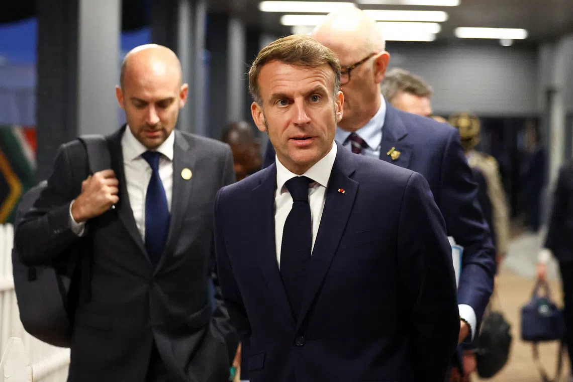 France’s President Emmanuel Macron arrives to speak with members of the media on the sidelines of the G20 Leaders' Summit in Johannesburg, South Africa, November 22, 2025. REUTERS/Siphiwe Sibeko