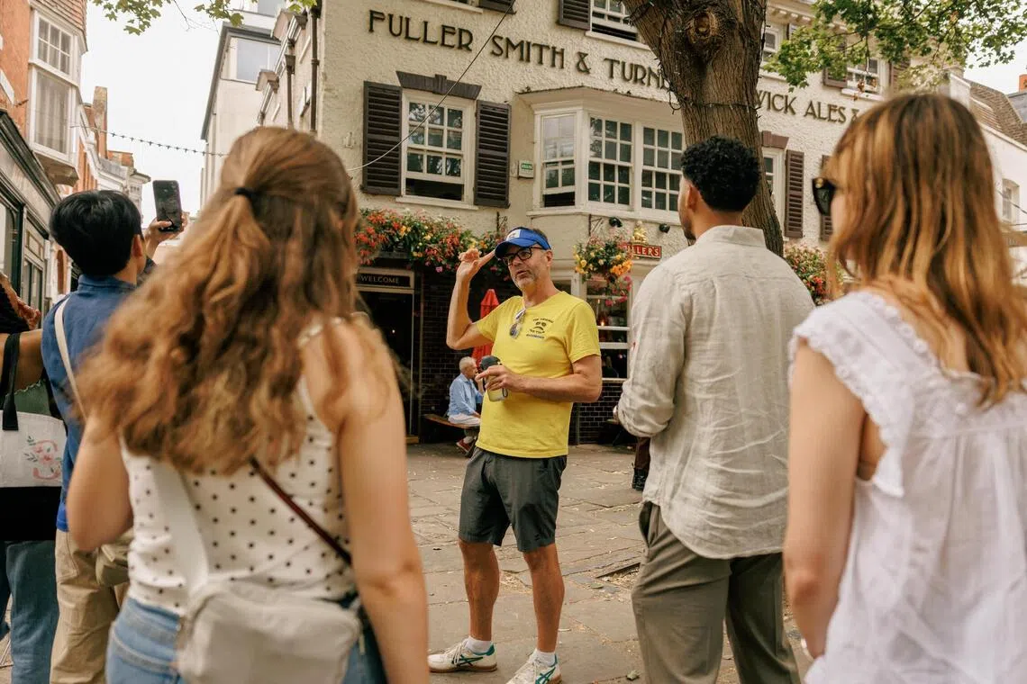 Matt Allard leads a tour of popular Ted Lasso locations in the Richmond-upon-Thames suburb of London on July 26.