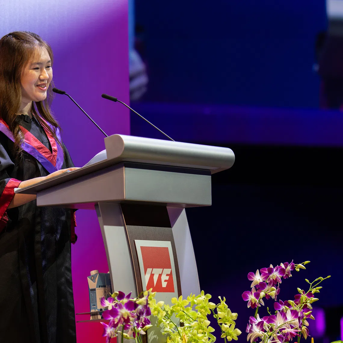 Sheryl Danielle Eng, 27, who was valedictorian of diploma graduates from the Class of 2026, delivering her valedictory speech during ITE’s graduation ceremony on July 22.