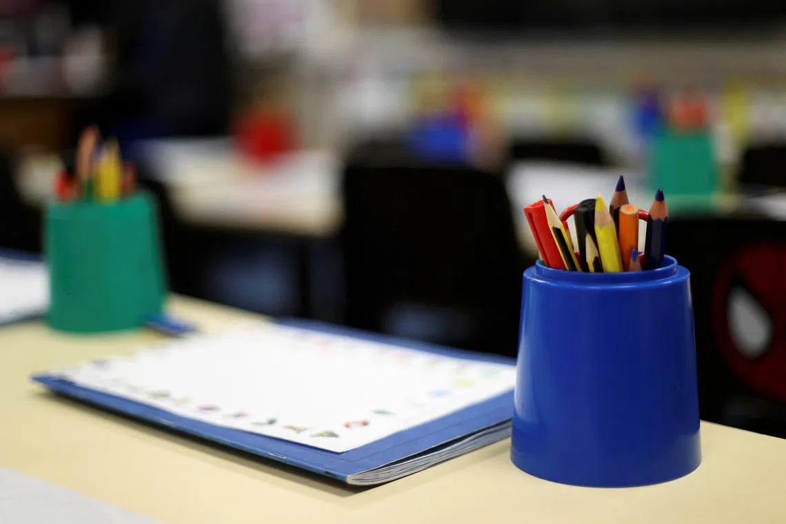 FILE PHOTO: Pencils are pictured in an empty classroom at Westlands Primary School, amid the coronavirus disease (COVID-19) outbreak, in Newcastle-under-Lyme, Staffordshire, Britain, January 4, 2021. REUTERS/Carl Recine/File Photo