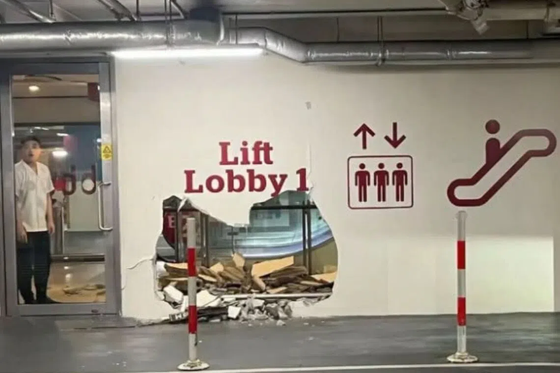 A vehicle had collided with a wall panel near a lift lobby.