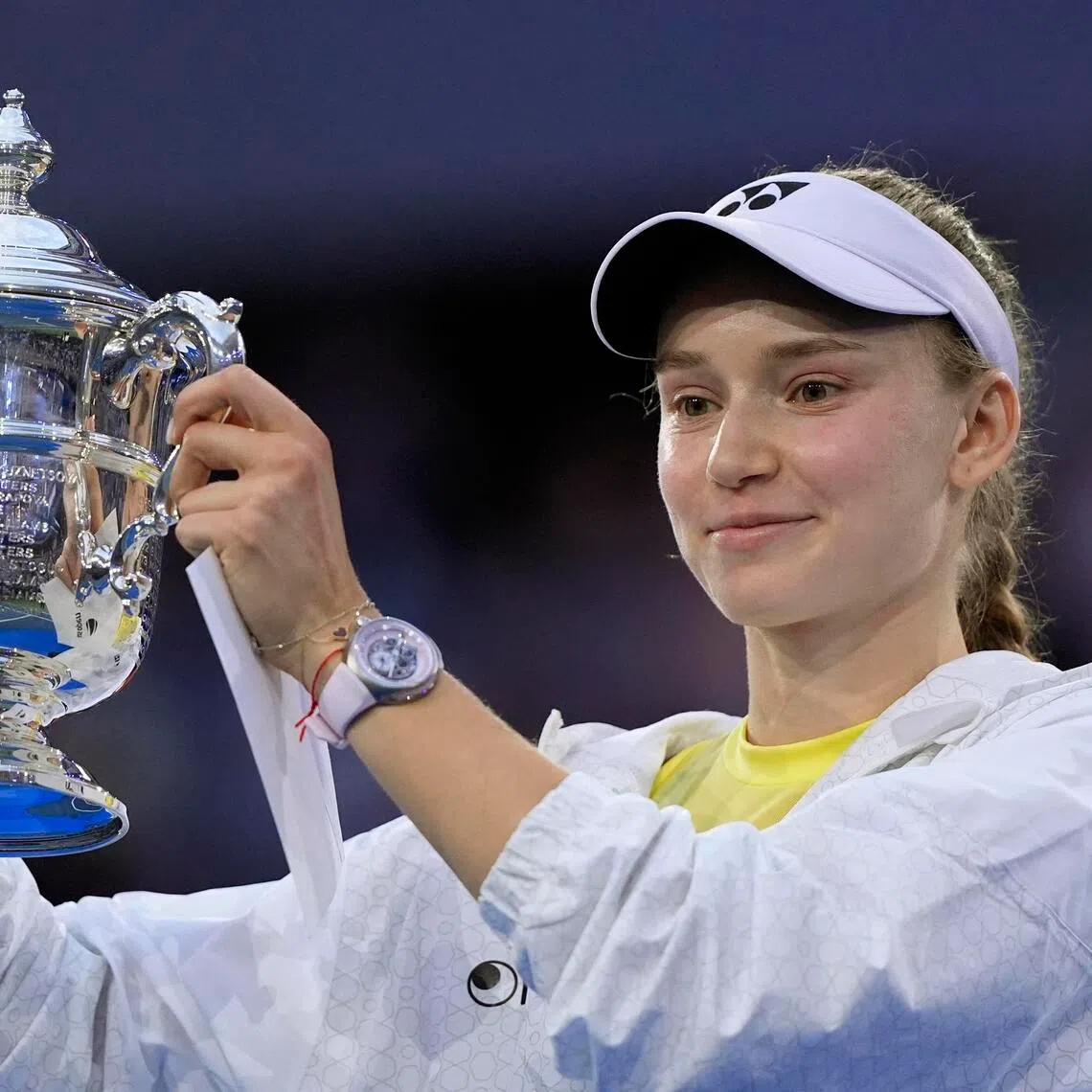 Elena Rybakina celebrates with the trophy after winning the women’s singles final match against Aryna Sabalenka.
