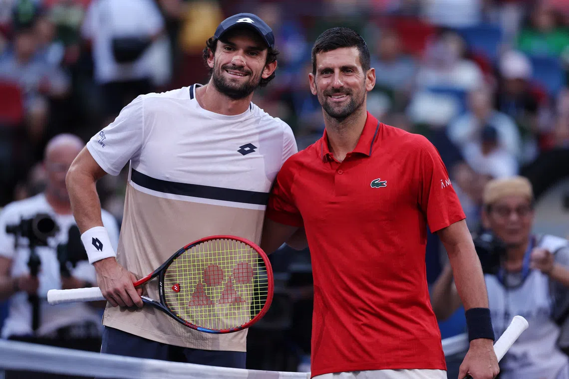 Tennis - ATP Masters 1000 - Shanghai Masters - Qizhong Forest Sports City Arena, Shanghai, China - October 11, 2025  Monaco's Valentin Vacherot and Serbia's Novak Djokovic pose ahead of their semi final match REUTERS/Go Nakamura