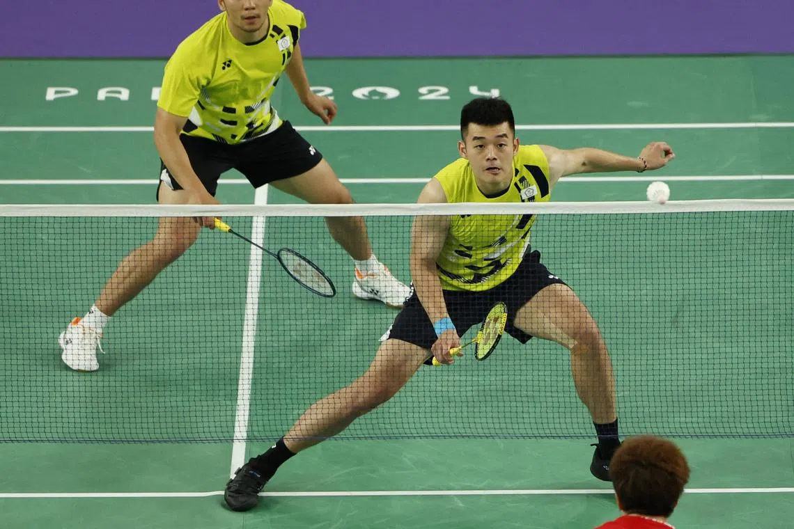 Paris 2024 Olympics - Badminton - Men's Doubles Gold Medal Match - Porte de La Chapelle Arena, Paris, France - August 04, 2024. Chi-Lin Wang of Taiwan and Yang Lee of Taiwan in action during the match against Wei Keng Liang of China and Chang Wang of China. REUTERS/Hamad I Mohammed