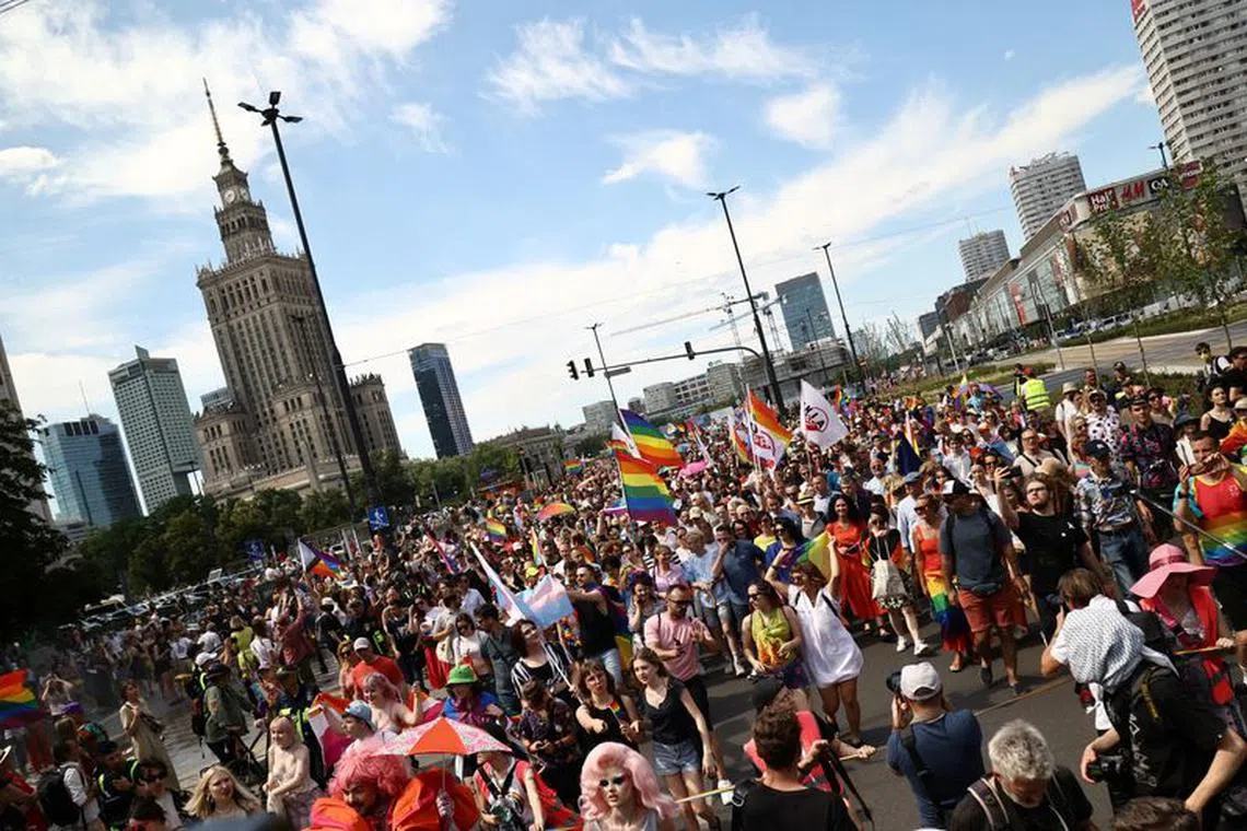 People take part in a joint equality march of the Warsaw Equality Parade 2022 and KyivPride, amid Russia's invasion of Ukraine, in Warsaw, Poland June 25, 2022. REUTERS/Kuba Stezycki/File Photo