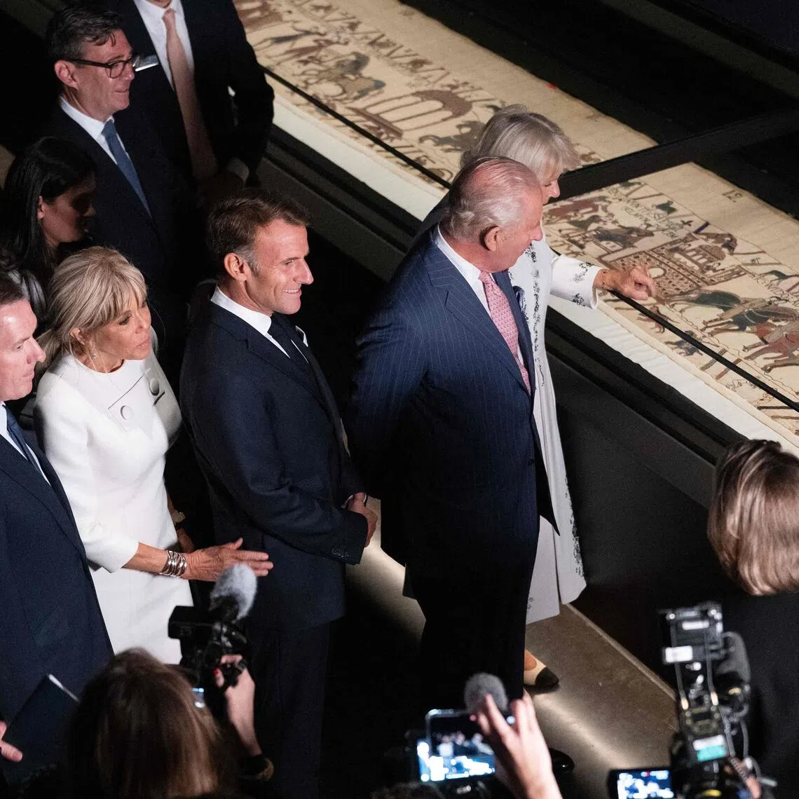 Britain’s King Charles (second from right) and Queen Camilla (right) with French President Emmanuel Macron (centre) and his wife Brigitte Macron (third from left) view sections of the Bayeux Tapestry at the British Museum.
