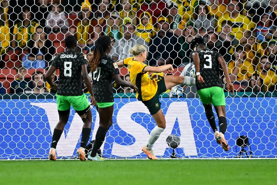 Osinachi Ohale heading home Nigeria's second goal against the Matildas.