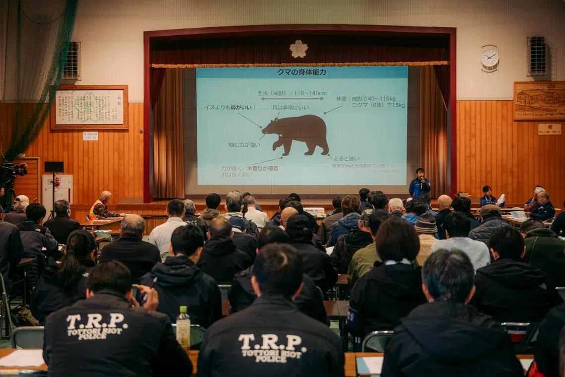 Local officials, police and hunters at a bear-safety workshop at Japan’s Tottori prefecture.
