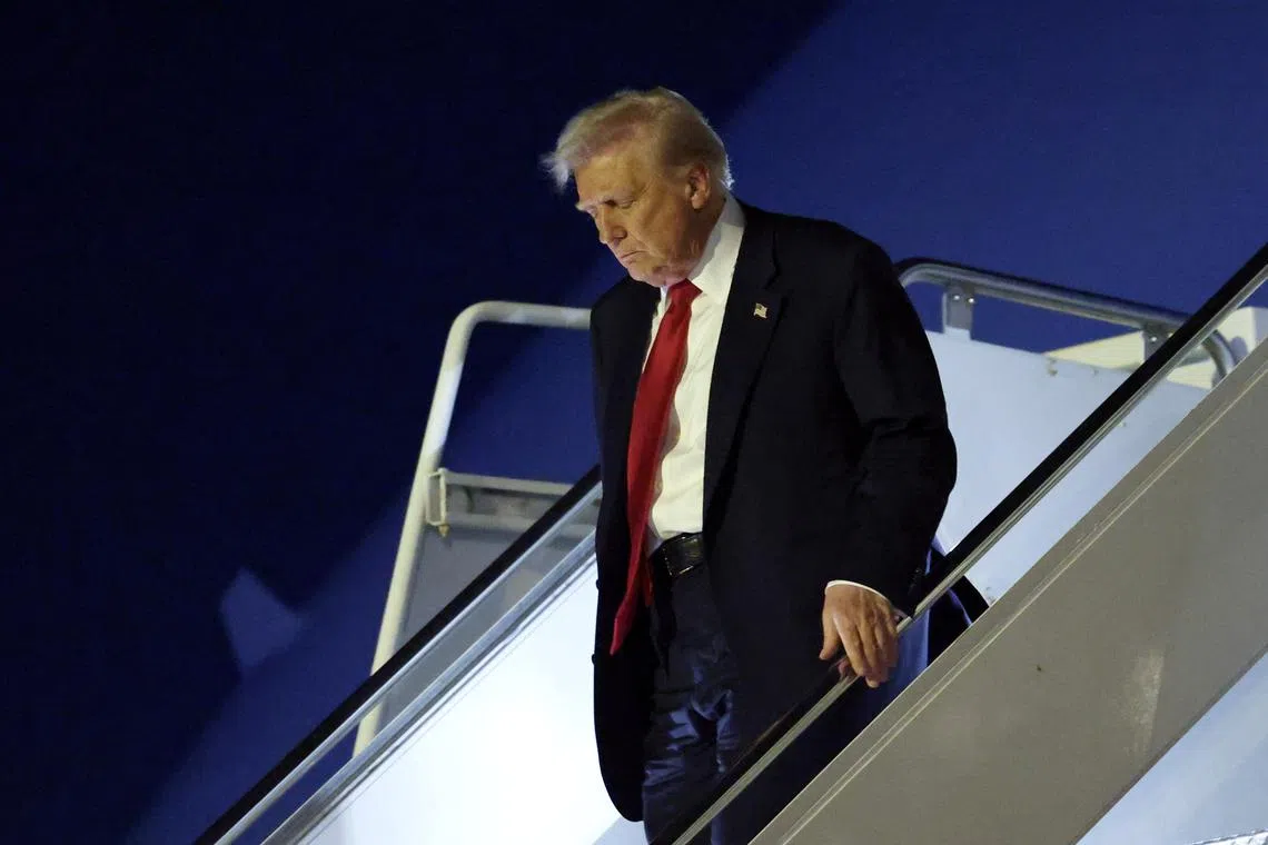 U.S. President Donald Trump disembarks Air Force One upon his arrival in West Palm Beach, Florida, U.S., March 14, 2025. REUTERS/Kevin Lamarque/File Photo