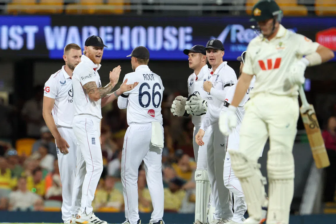 Cricket - The Ashes - Australia v England - Second Test - The Gabba, Brisbane, Australia - December 7, 2025 England's Ben Stokes celebrates after Gus Atkinson takes the wicket of Australia's Marnus Labuschagne, caught by Jamie Smith REUTERS/Hollie Adams