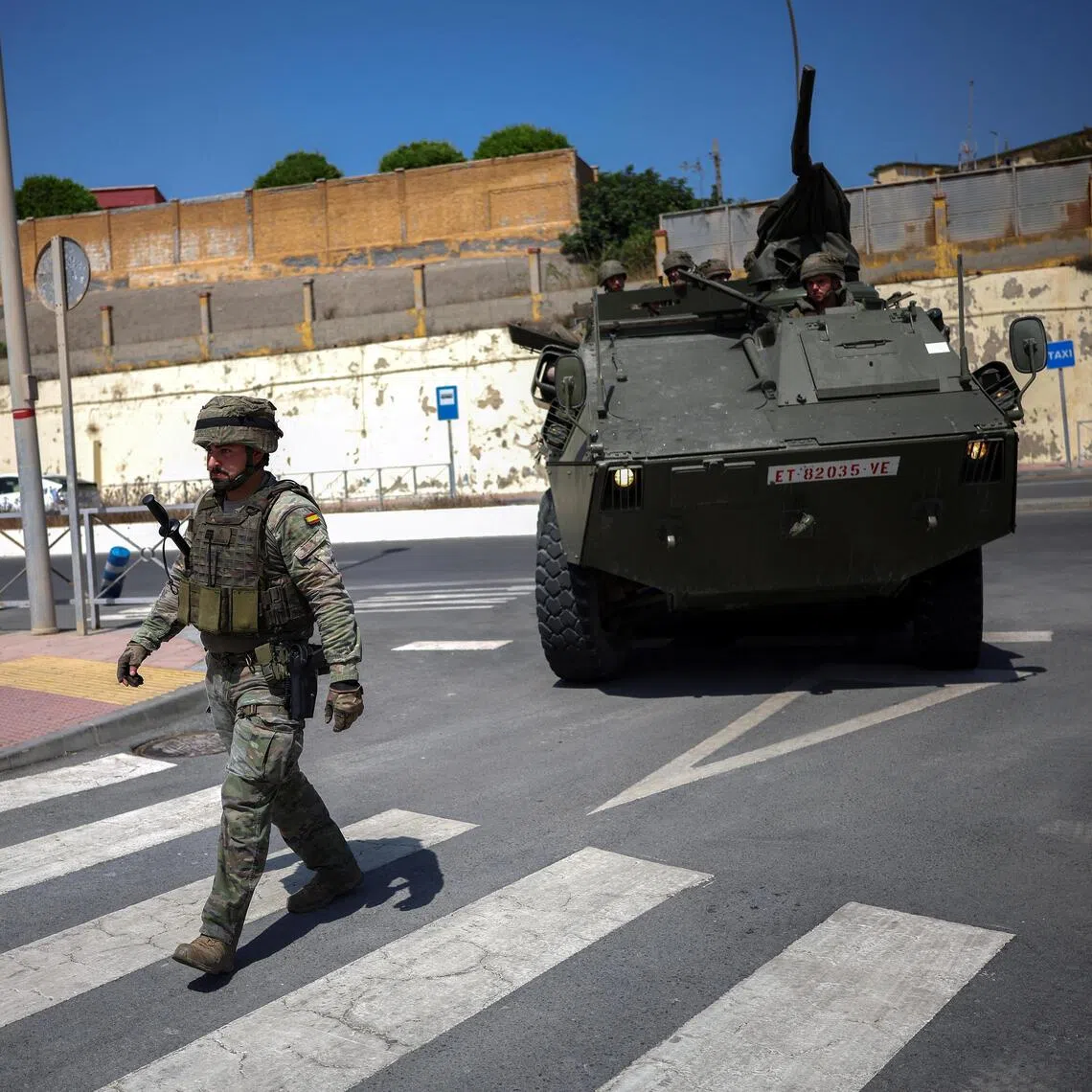 Spanish military personnel arriving at Ceuta’s border with Morocco on Aug 15, following a mass crossing of migrants into the tiny Spanish territory the previous month.