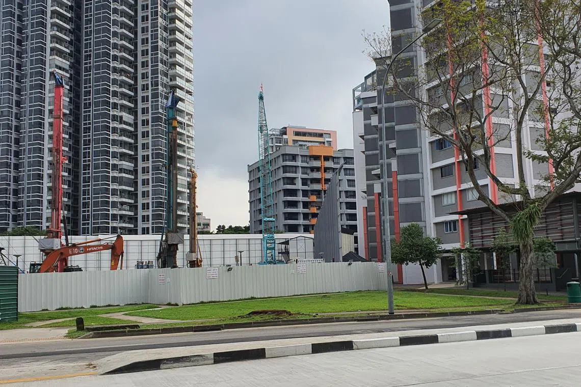 Noisy pile drivers being used in this construction site at Pek Kio.