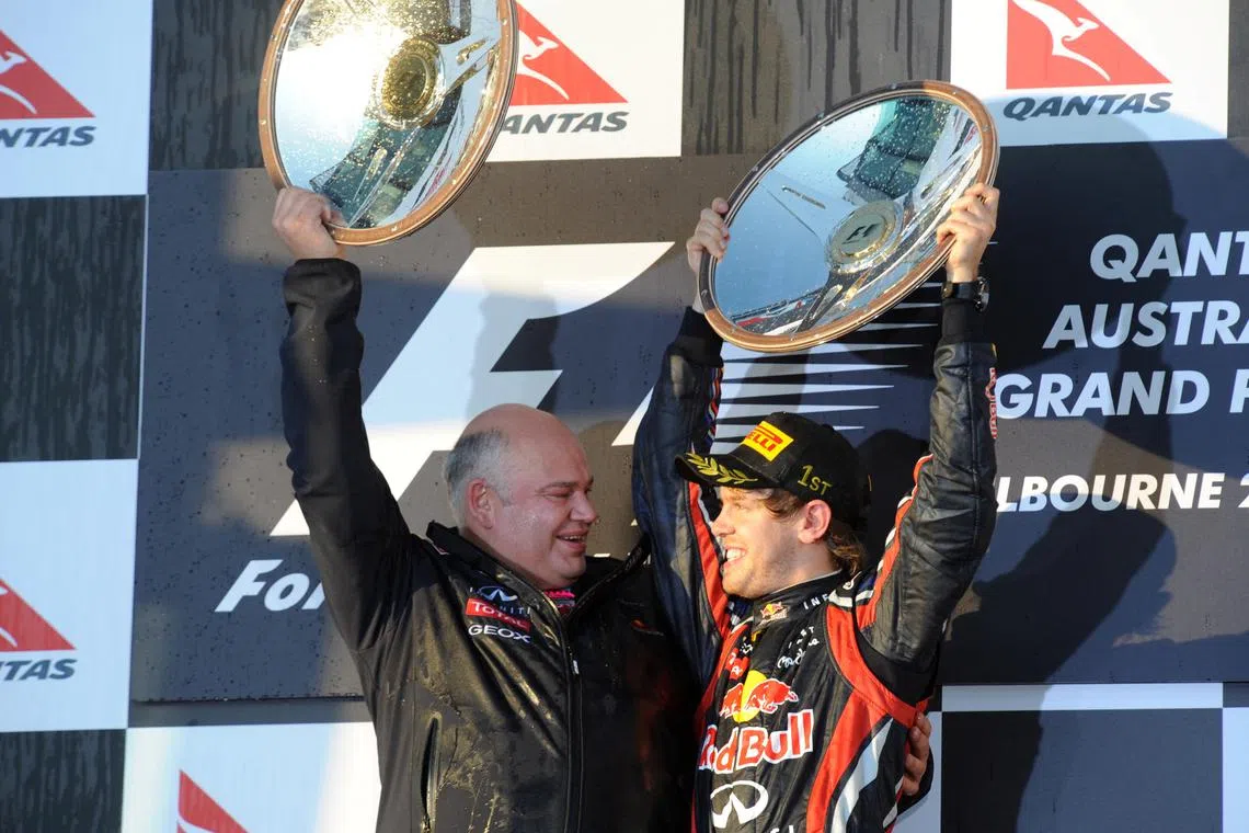 FILE PHOTO: Formula One - F1 - Australian Grand Prix 2011 - Albert Park Grand Prix Circuit, Melbourne, Australia - 27/3/11
Sebastian Vettel (R) and Chief Designer Rob Marshall of Red Bull celebrates their win on the podium with the trophy
Mandatory Credit: Action Images / Crispin Thruston/File Photo