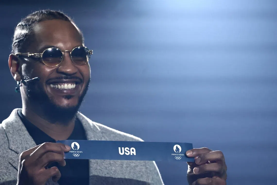 Paris 2024 Olympics - Olympic Basketball Tournament Draw - Patrick Baumann House of Basketball, Mies, Switzerland - March 19, 2024 FIBA ambassador Carmelo Anthony draws United States for the Men's Olympic Basketball Tournament REUTERS/Denis Balibouse