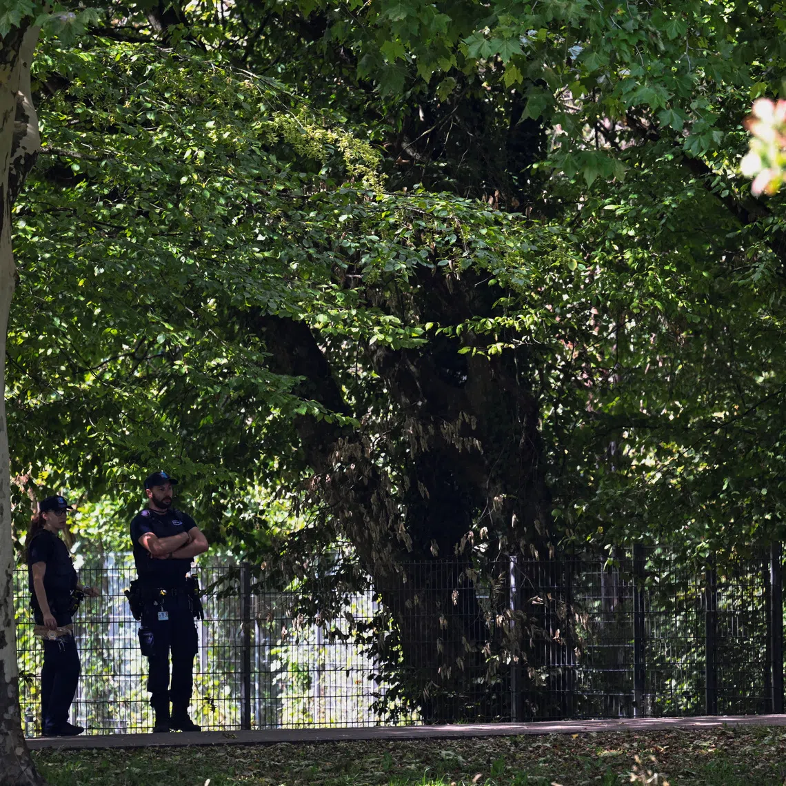 Police stand near the site of a deadly shooting at a rave party, according to the police, at Schachen in Aarau, Switzerland.