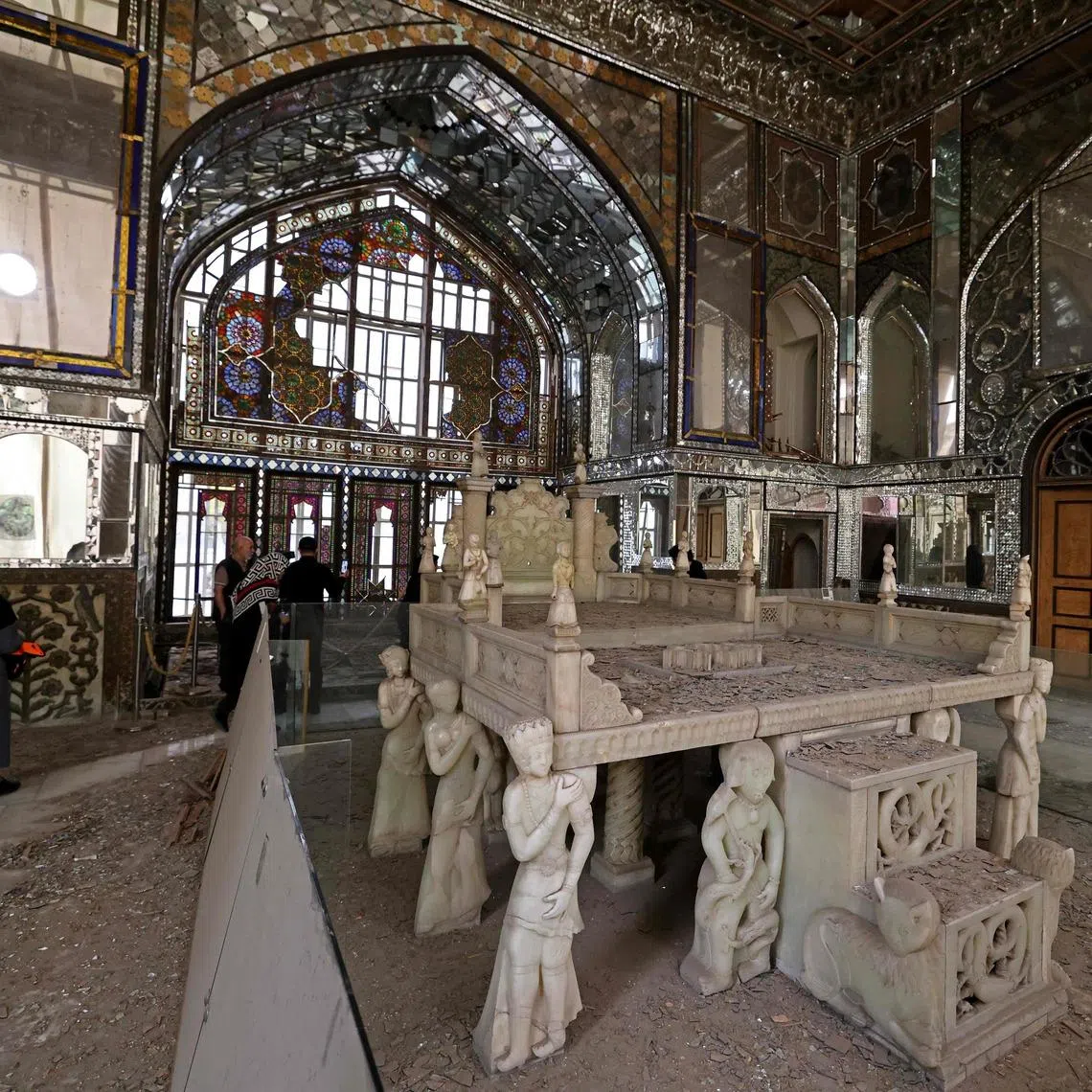 Visitors walking through the damaged interiors of the historic Golestan Palace in Tehran, on April 4.