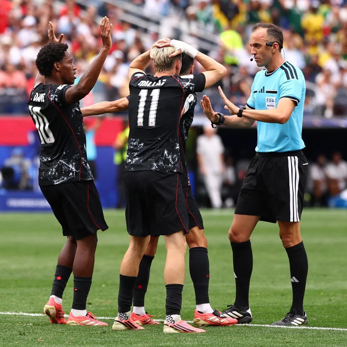 Canada’s Stephen Eustaquio, Liam Millar and Jonathan David appealing for a penalty to the referee during their 1-0 World Cup win over South Africa on June 28.