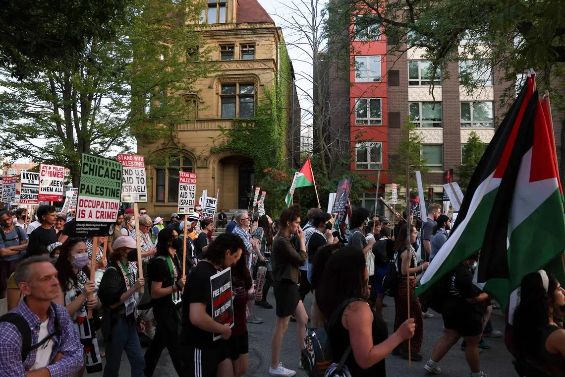 Demonstrators march during a protest in support of Palestinians in Gaza, in the sidelines of the Democratic National Convention (DNC) in Chicago, Illinois, U.S., August 22, 2024. REUTERS/Leah Millis