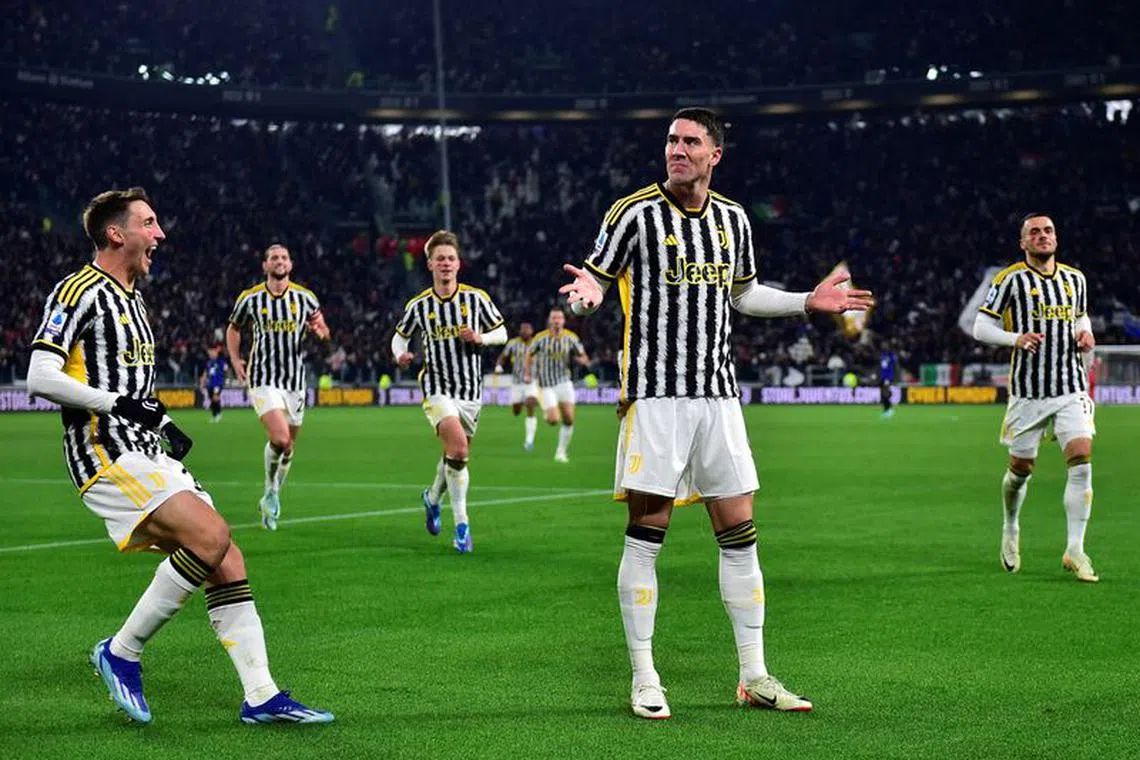 Soccer Football - Serie A - Juventus v Inter Milan - Allianz Stadium, Turin, Italy - November 26, 2023 Juventus' Dusan Vlahovic celebrates scoring their first goal with Andrea Cambiaso REUTERS/Massimo Pinca/ File photo