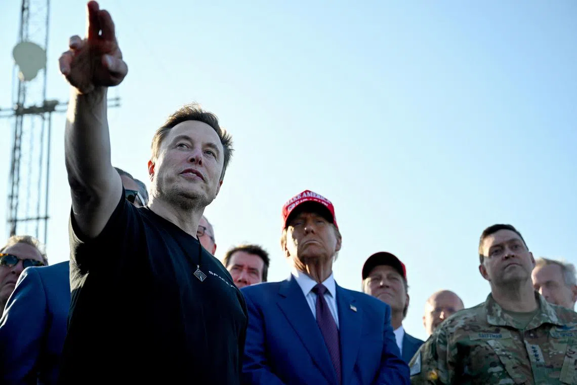 Elon Musk speaks with US President-elect Donald Trump and guests at a viewing of the launch of the sixth test flight of the SpaceX Starship.