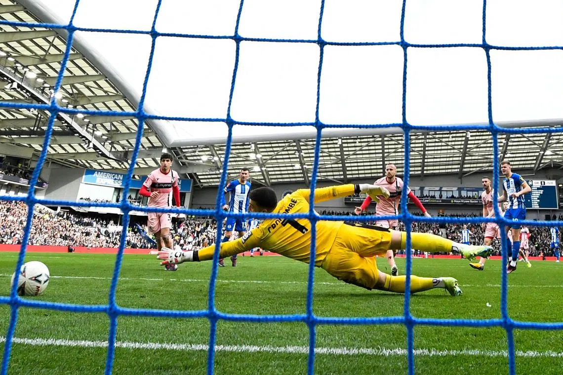 Brighton's Irish striker Evan Ferguson scores his team second goal during the English FA Cup quarter-final match.
