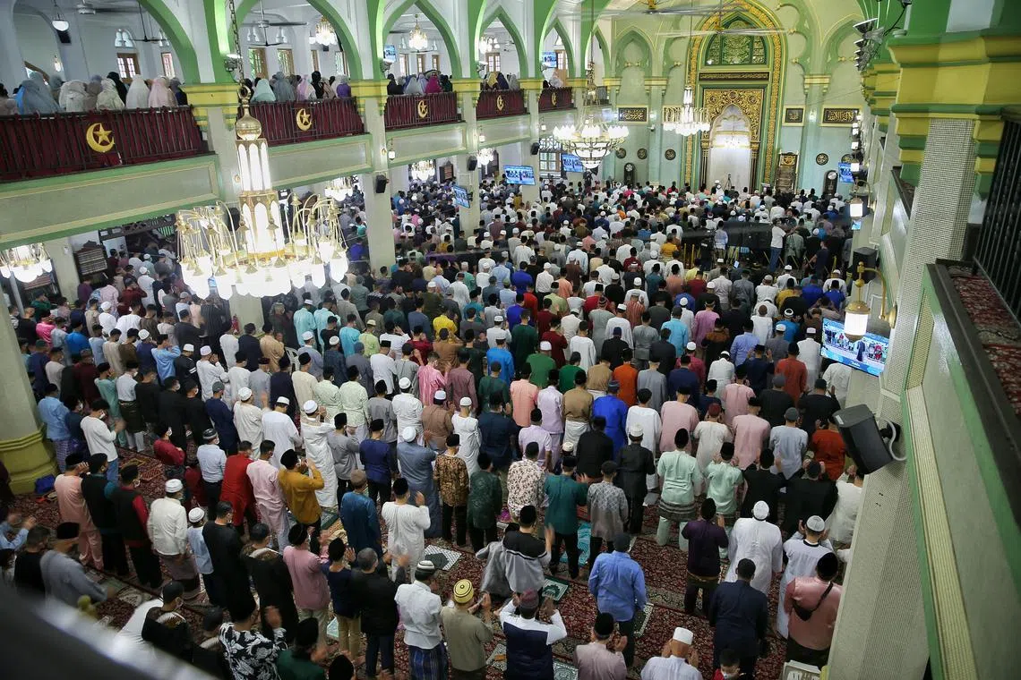 Muslims praying at Masjid Sultan on the morning of Hari Raya Aidilfitri in May 2022.