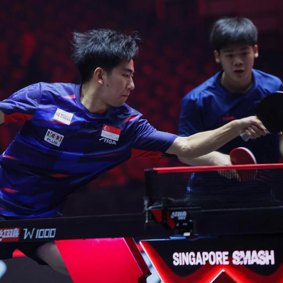 Singapore's Koen Pang (left) and Izaac Quek in action  during their 3-2 WTT Singapore Smash defeat by Horacio Cifuentes and Santiago Lorenzo of Argentina in the men’s doubles last 16 at the OCBC Arena on Feb 24.