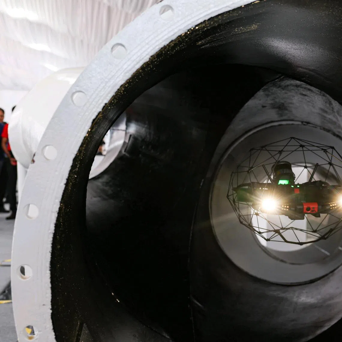 ST20240919_202406700133/vcship19/Brian Teo/Vanessa Paige Chelvan/Attendees watching the drone inspection demonstration at ST Engineering's new Gul shipyard on September 18, 2024. ST PHOTO: BRIAN TEO.