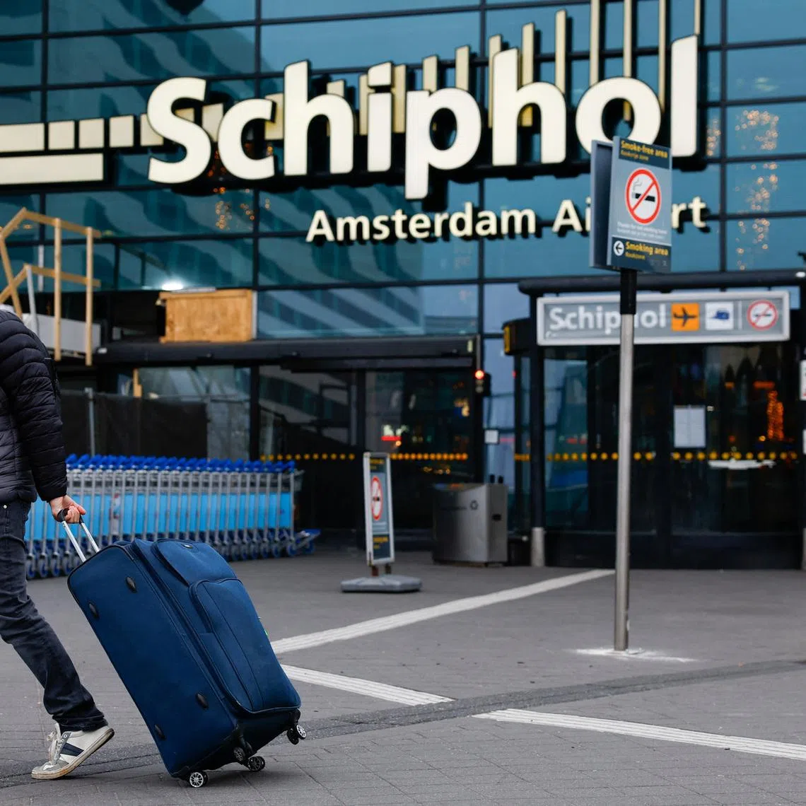 A person walks at Amsterdam Airport Schiphol in Amsterdam, Netherlands, November 8, 2024. REUTERS/Piroschka Van De Wouw