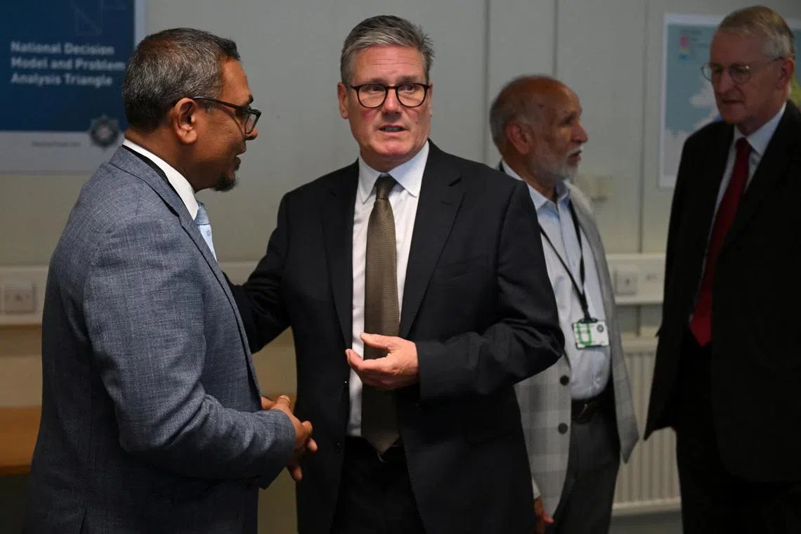 British Prime Minister Keir Starmer talks with staff during a visit to Garnerville Police training college on August 19, 2024, in Belfast, Northern Ireland.     Charles McQuillan/Pool via REUTERS/ File Photo