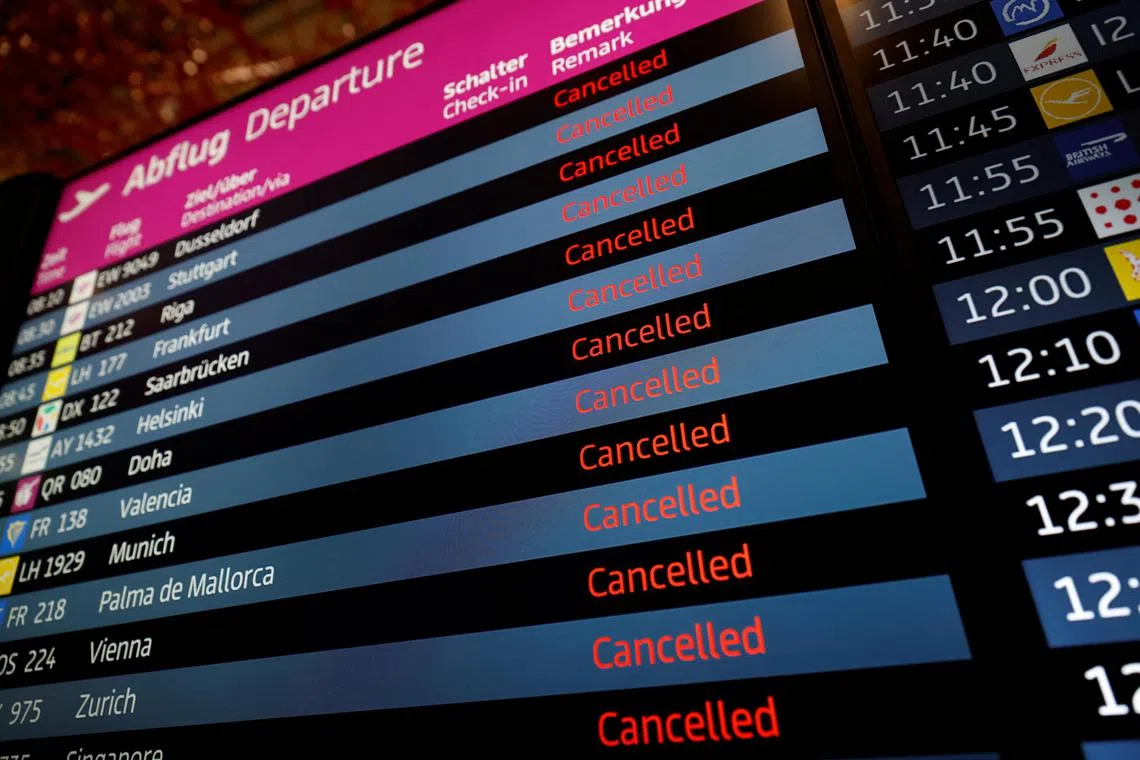 Departure panel shows canceled flights during a general strike by employees over pay demands, at the Berlin Brandenburg Airport (BER), in Schoenefeld near Berlin, Germany January 25, 2023. REUTERS/Michele Tantussi
