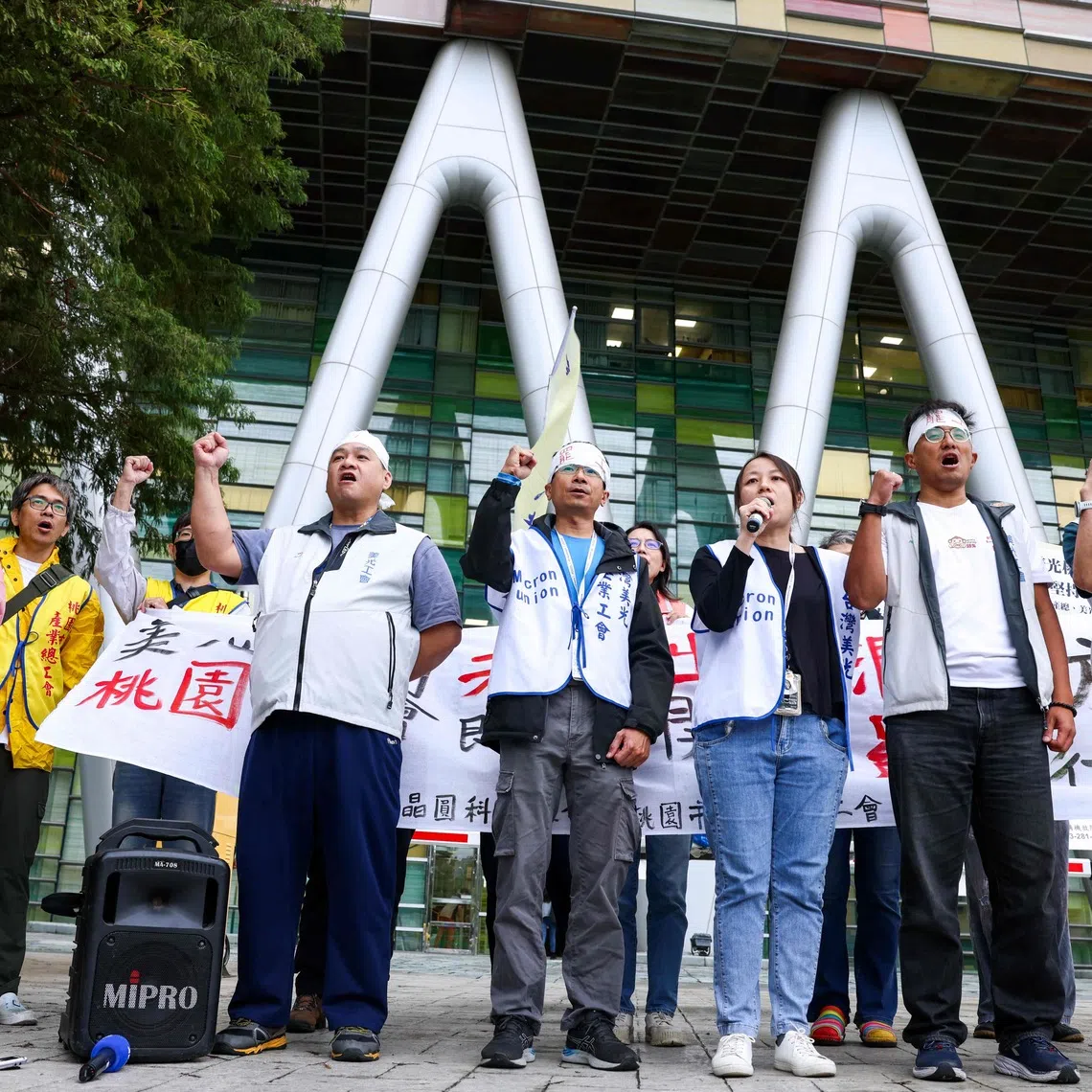 Union representatives and members demanding greater profit shares and better bonuses outside Micron Technology’s building in Taoyuan on Oct 22.