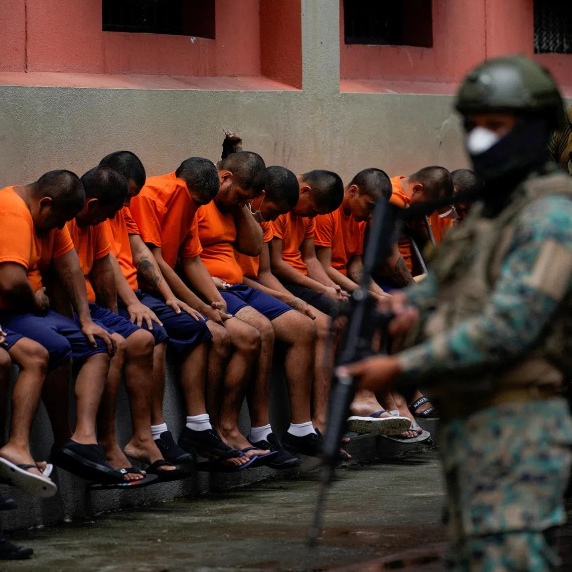 FILE PHOTO: Inmates in cell block 3 bow their head as they listen to a soldier at the militarized Litoral prison,as part of the measures taken by Ecuador's President Daniel Noboa to crackdown on gangs, during a media tour in Guayaquil, Ecuador, February 9, 2024. REUTERS/Santiago Arcos/File Photo